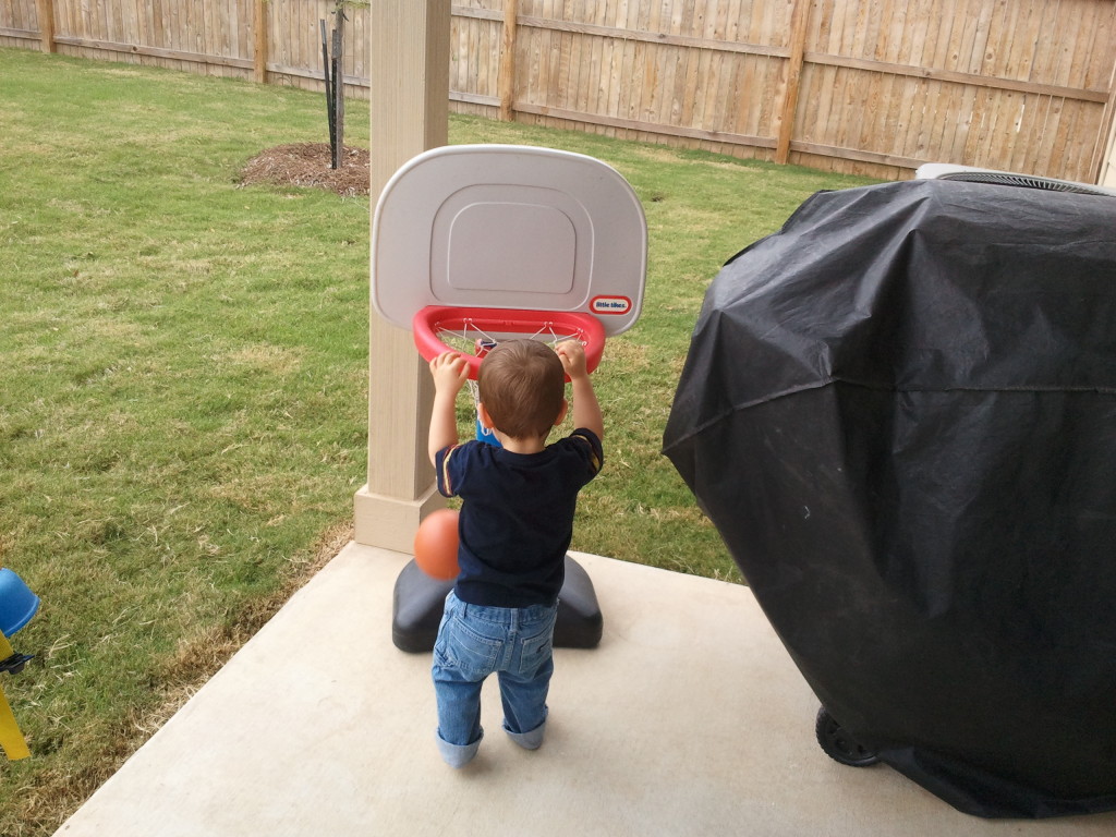 Dunking the basketball.