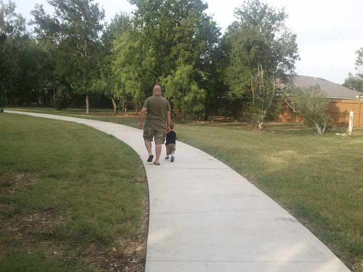 Walking with Daddy at the park