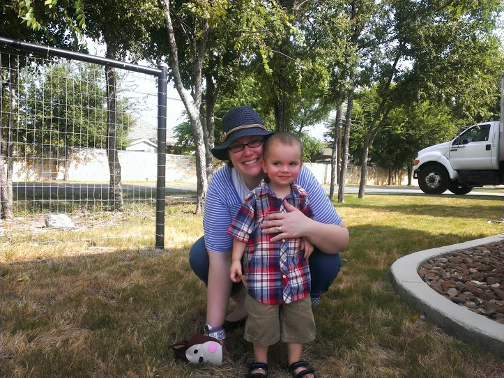 We went to the stake-sponsored Pioneer Day celebration. We only stayed for a little while: we let Joseph check out the animals at the petting zoo and run around the field, and then it was time to go...too hot!