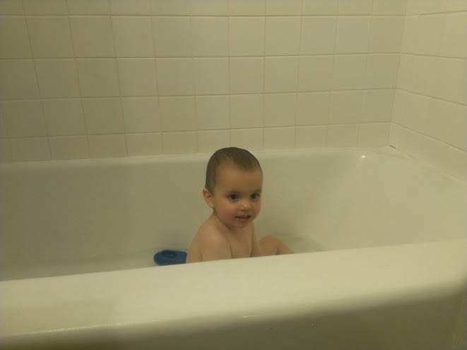 Doing one of the things he loves best: bath time!